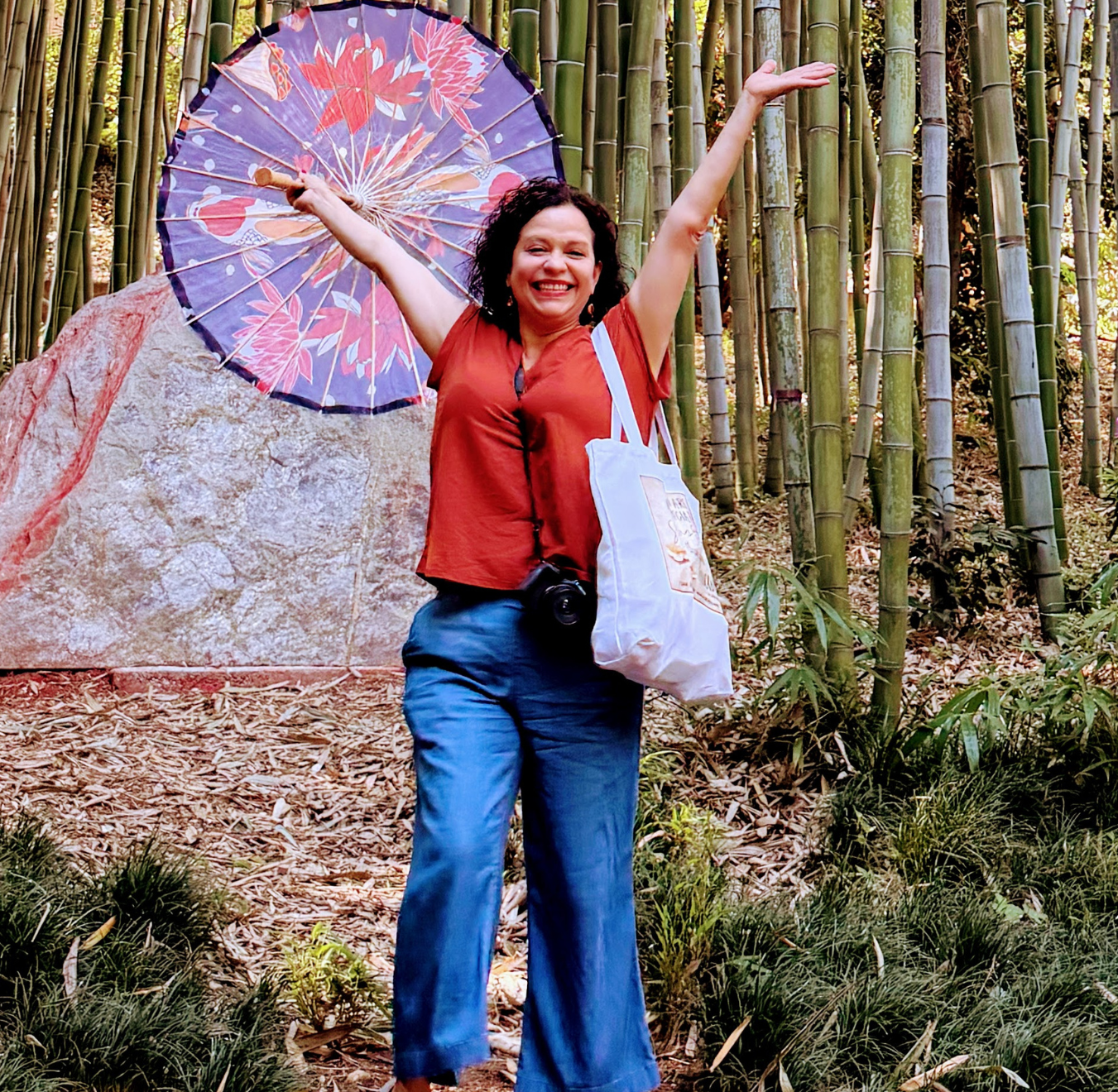 Woman in a bamboo forest with japanese style parasol